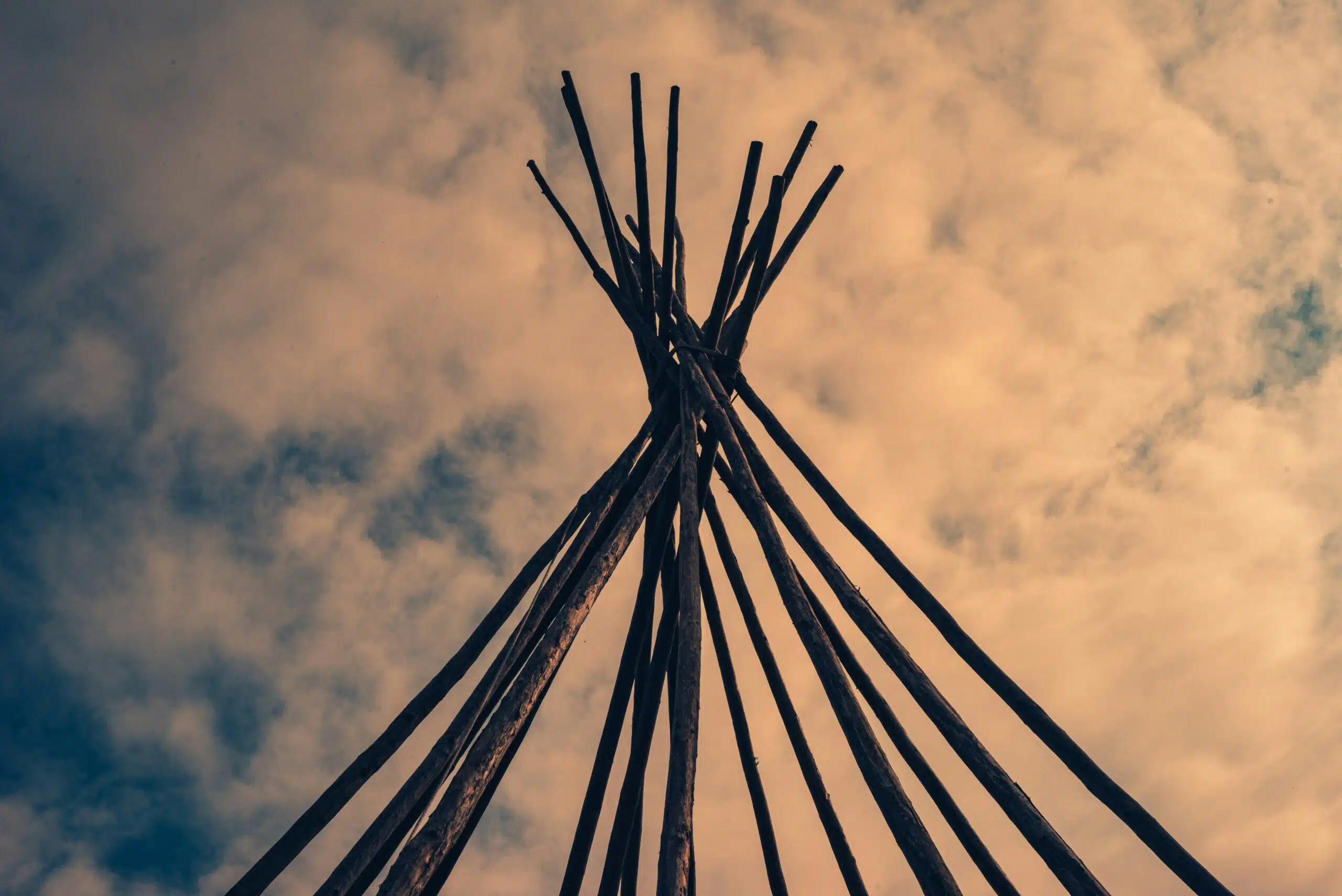 Teepee supports seen at dusk