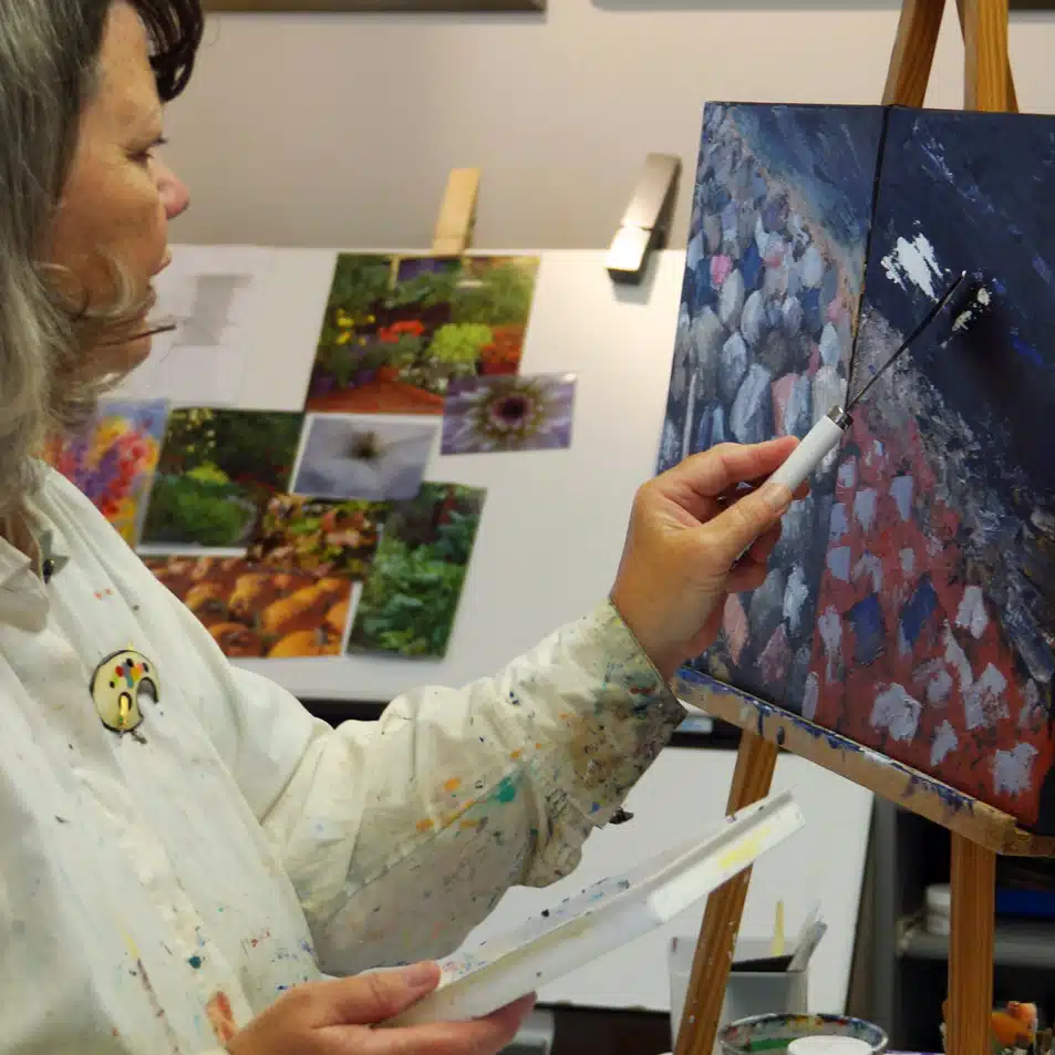woman painting on canvas