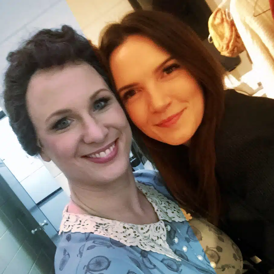 Two women standing together